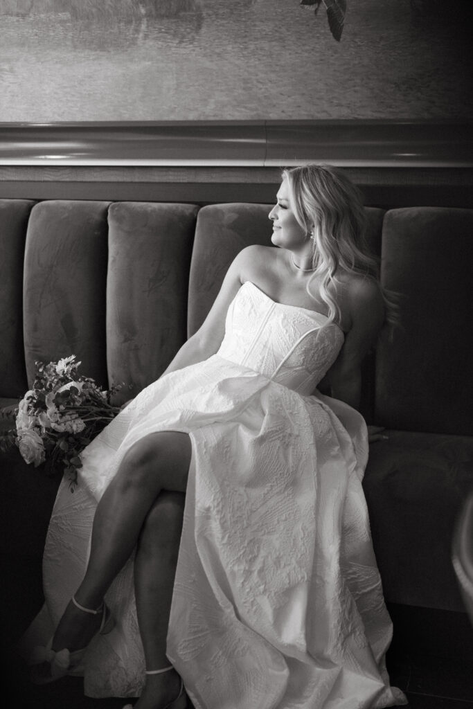 Bride reclining on sofa during quiet wedding portrait