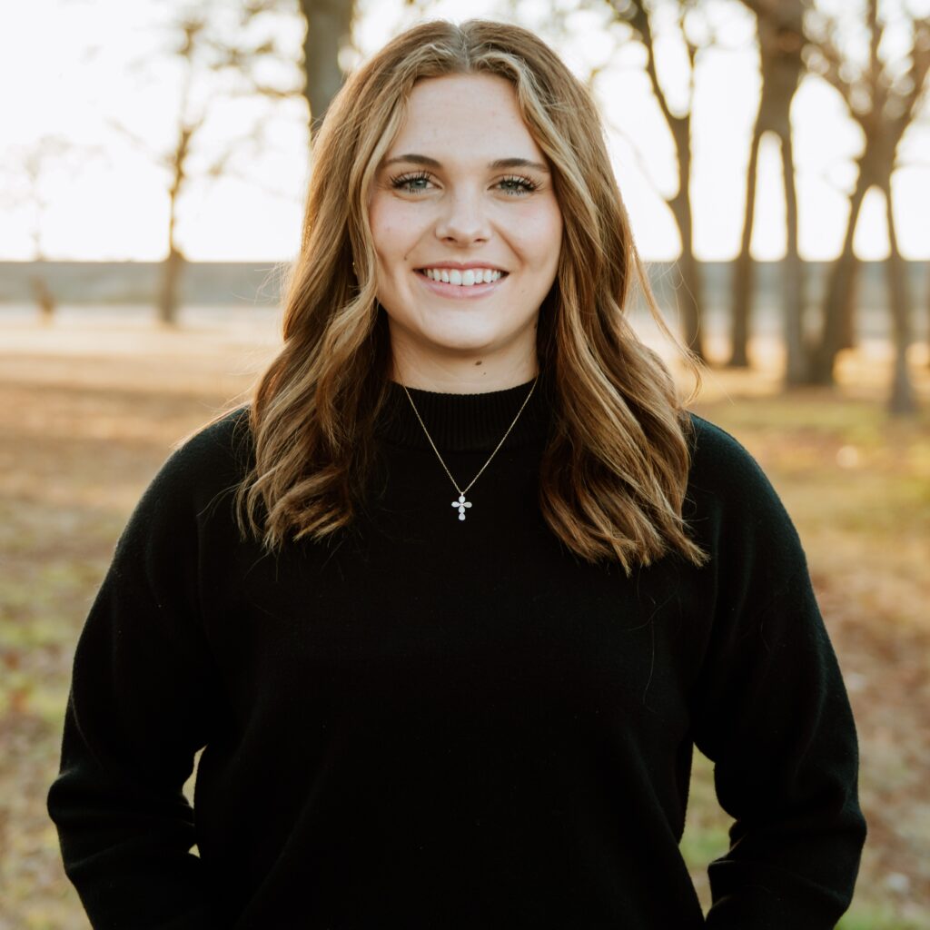 Kylie, wedding planner, smiling outdoors