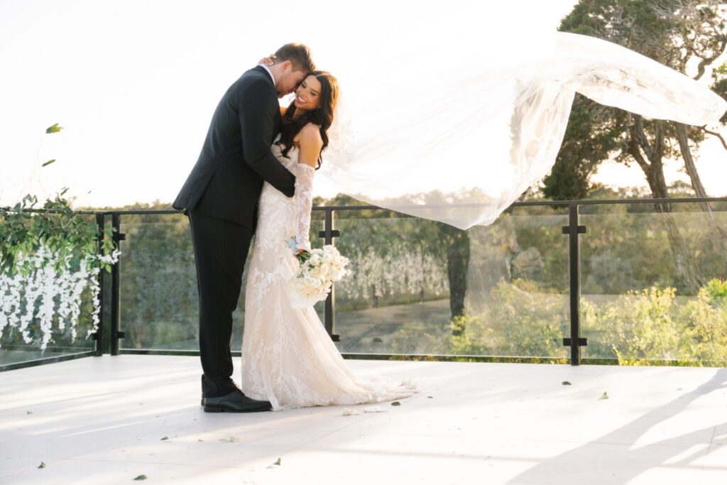 Bride and groom embracing in Texas Hill Country