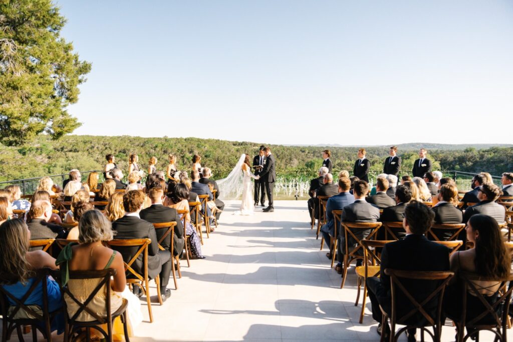 Bride and groom exchanging vows at a venue in Texas Hill Country